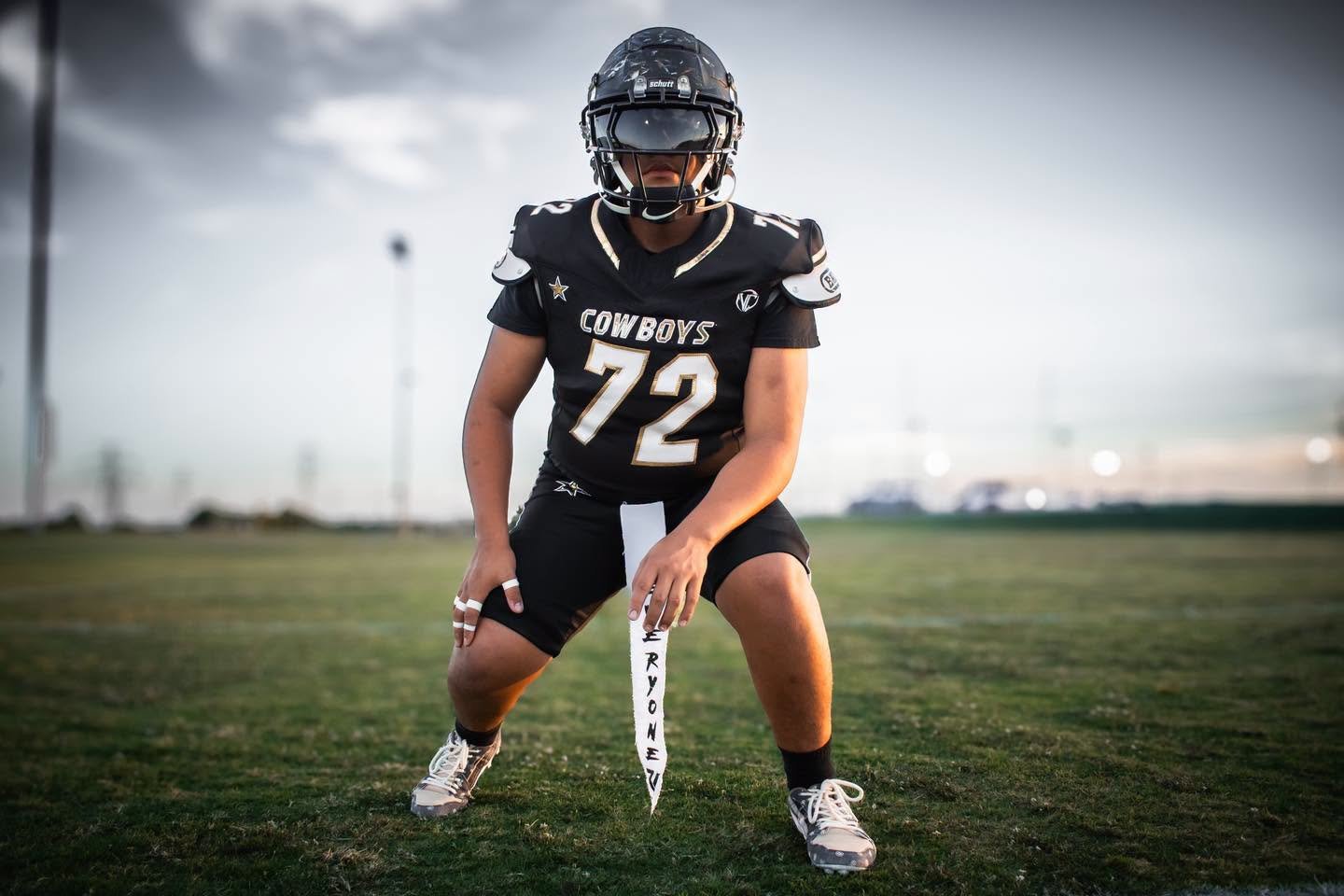 NTX Cowboys lineman number 72 in a ready stance on the field